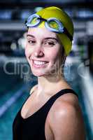 Portrait of a woman swimmer looking the camera