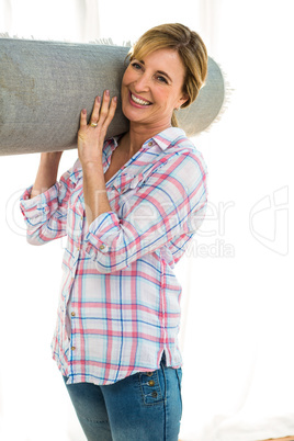 Woman holding a carpet