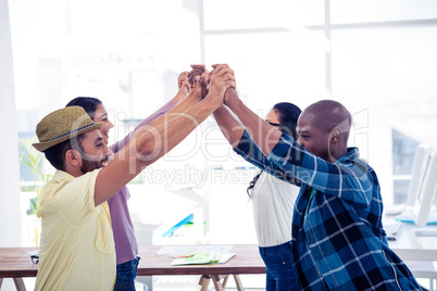 Cheerful Businessmen and businesswomen performing group activity