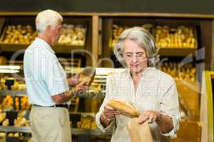 Senior couple buying bread
