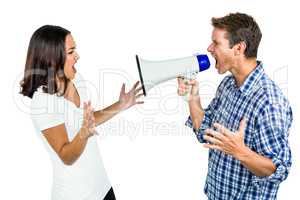 Couple shouting with man holding megaphone