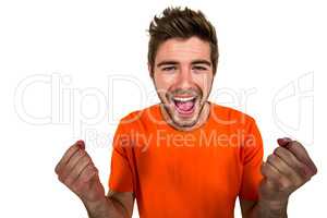 Portrait of excited man with hands clasped