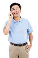 Happy man talking on mobile phone while standing