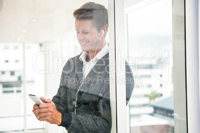 Close-up of man using mobile phone at office