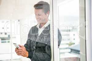 Close-up of man using mobile phone at office