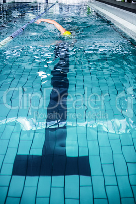 Fit man swimming with swimming hat