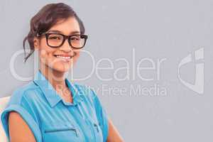 Composite image of portrait of smiling businesswoman wearing rea
