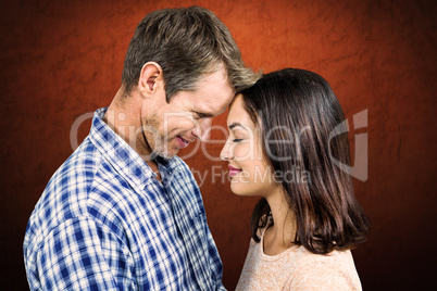 Composite image of close-up of romantic couple standing face to