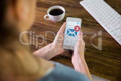 Composite image of woman using smartphone