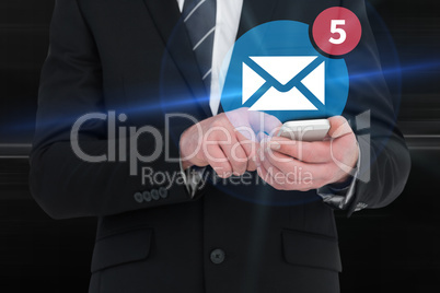 Composite image of businessman sending a text message