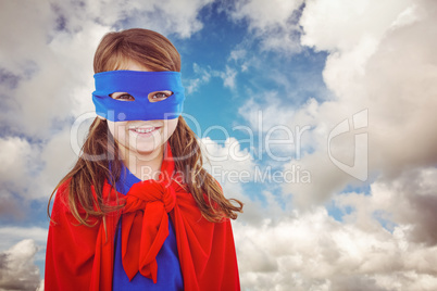 Composite image of masked girl pretending to be superhero