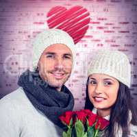Composite image of smiling couple holding roses bouquet