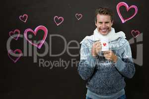 Composite image of portrait of happy man holding mug