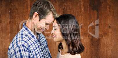 Composite image of close-up of romantic couple standing face to