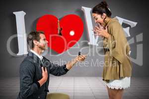 Composite image of happy man offering engagement ring to partner