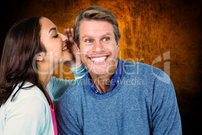 Composite image of woman sharing secret with man