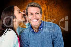 Composite image of woman sharing secret with man