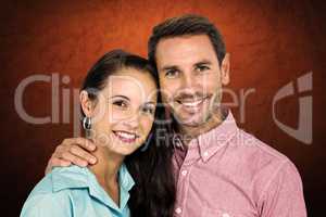 Composite image of smiling couple looking at camera