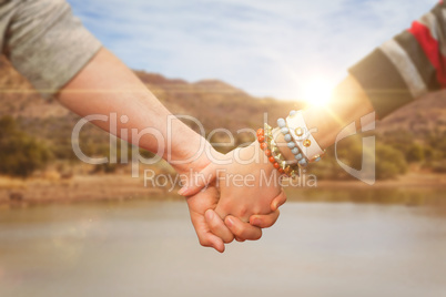 Composite image of students holding hands