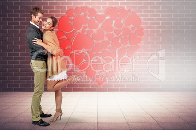 Composite image of full length of romantic couple hugging