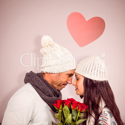 Composite image of smiling couple nose-to-nose holding roses bou