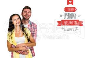 Composite image of happy couple hugging and looking away