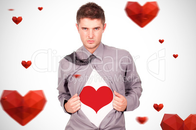 Composite image of young attractive man pulling at his tshirt