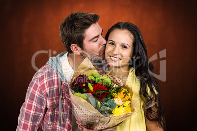 Composite image of smiling woman holding bouquet and being kisse