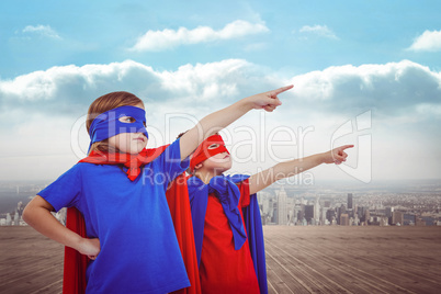 Composite image of masked kids pretending to be superheroes