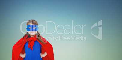 Composite image of masked girl pretending to be superhero