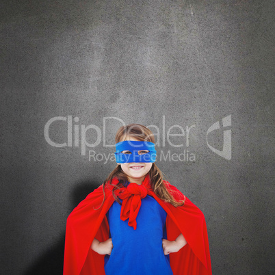 Composite image of masked girl pretending to be superhero