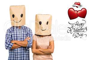 Composite image of couple with arms crossed wearing smiley paper