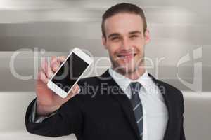 Composite image of smiling businessman showing his smartphone sc