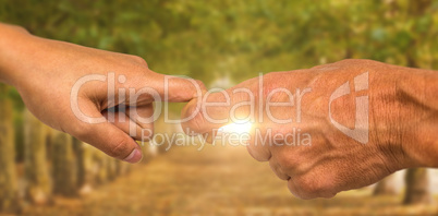 Composite image of cropped hands of people holding fingers