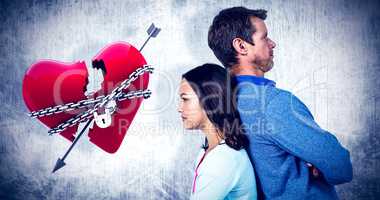 Composite image of angry couple standing back to back