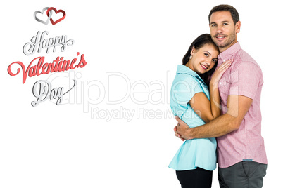 Composite image of smiling couple hugging and looking at camera