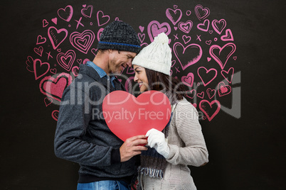 Composite image of festive couple in winter clothes