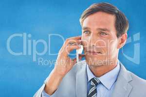 Composite image of business man having phone call