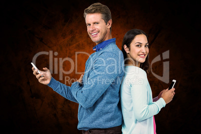 Composite image of smiling man and woman using phone