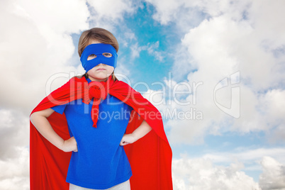 Composite image of masked girl pretending to be superhero