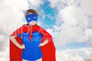 Composite image of masked girl pretending to be superhero