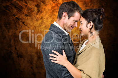 Composite image of side view of romantic couple hugging