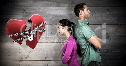 Composite image of couple standing back to back