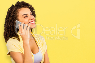 Composite image of smiling businesswoman using smart phone while