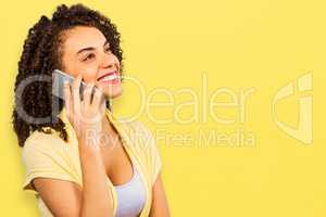 Composite image of smiling businesswoman using smart phone while