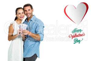 Composite image of happy couple holding money
