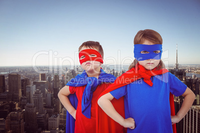 Composite image of masked kids pretending to be superheroes