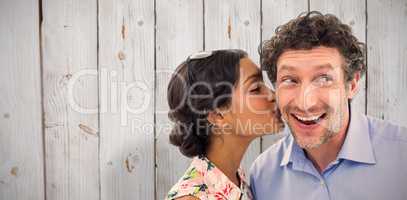 Composite image of pretty woman kissing man on cheek