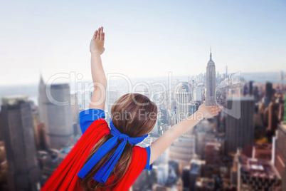 Composite image of masked girl pretending to be superhero