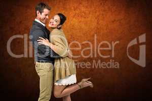 Composite image of full length of romantic couple hugging